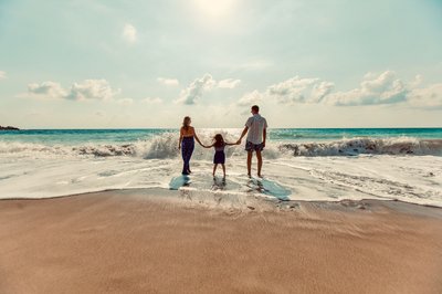 Beach family wave